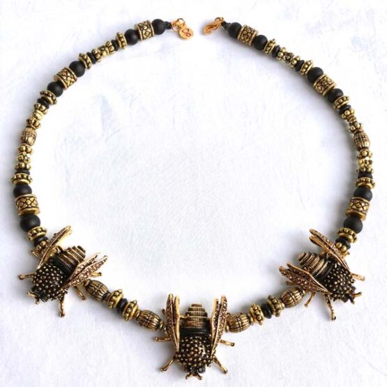 Stunning necklace with bees cast in golden metal.